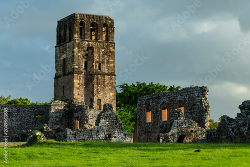 Ancient stone ruins of Panama viejo cathedral tower standing tall against a cloudy sky, representing historical heritage, archaeology, and the enduring past of Panama city - stock photo