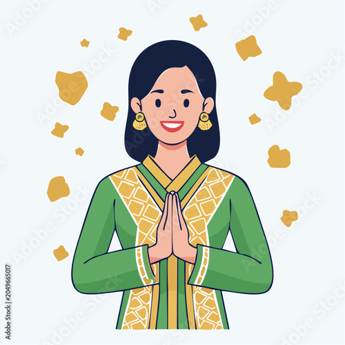 Woman in Traditional Green and Gold Outfit with Hands Clasped