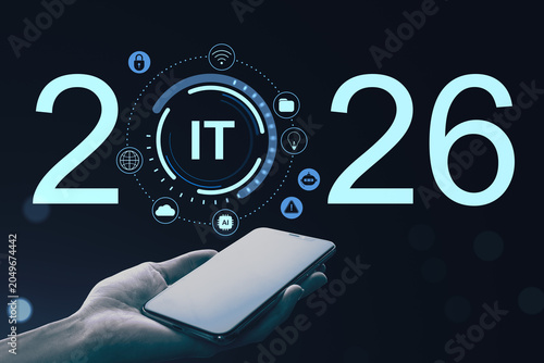 Digital future IT concept for year 2026 with smartphone in hand and glowing t...