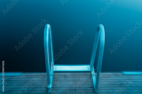 Canvas Print Stair leading to a lake in Sweden with a focus on the water and surrounding calm
