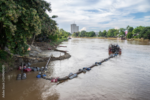 Photography Dredging operations are underway on the Ping River in Chiang Mai, Thailand, to remove sediment and debris