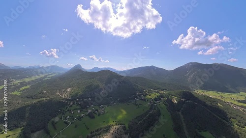 scenic  aerial footage pilot POV of french alps in Provence under blue sly and nice white clouds 