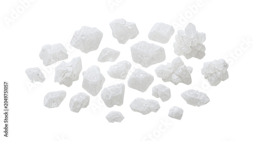 Group of coarse white sea salt crystals scattered on a pure isolated white background
