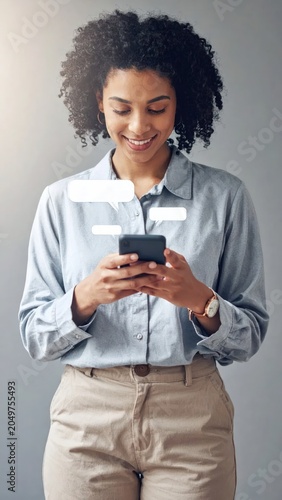 Smiling Young Woman Texting on Smartphone with Chat Bubbles in Neutral Studio