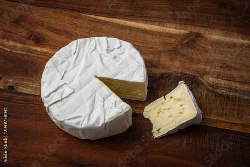 Camembert, a soft French cheese with a rind covered in noble mold.