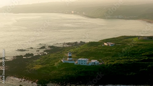 Aerial view of coastal lighthouse on rocky shore in Taiwan 
