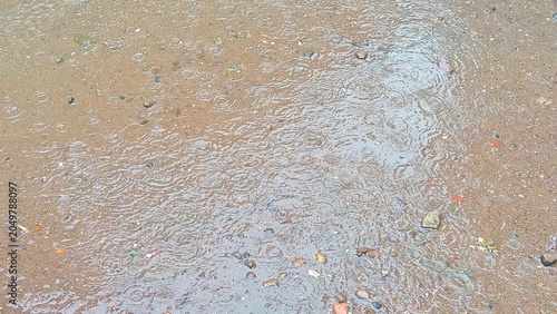 Bild auf Leinwand Wet muddy ground texture covered with water.