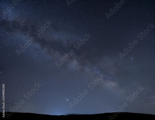 Starry Night Sky with Milky Way and Hills.