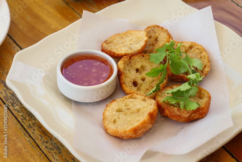 Fotografie Basreng or baso goreng or fried meat ball with chili sauce.