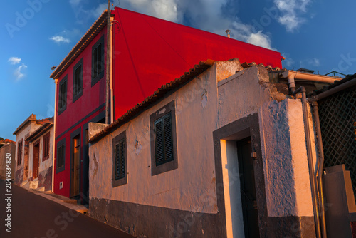 Ochre painted neighborhood houses in Funchal, Madeira