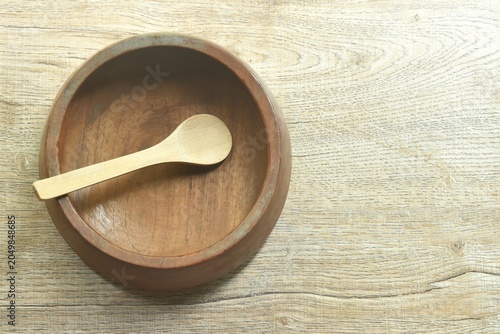 wooden spoon in brown bowl good for environment arranging on table