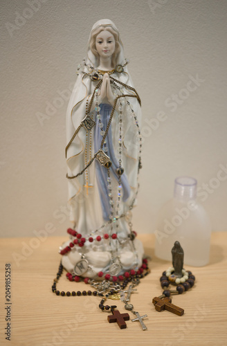 Rosaries, statues of the Virgin Mary, and holy water