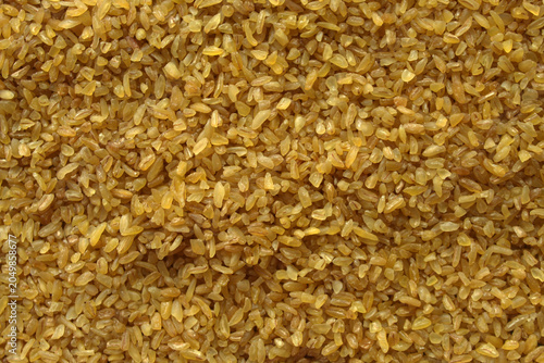 Schilderij op canvas Bulgur wheat groats macro texture top view