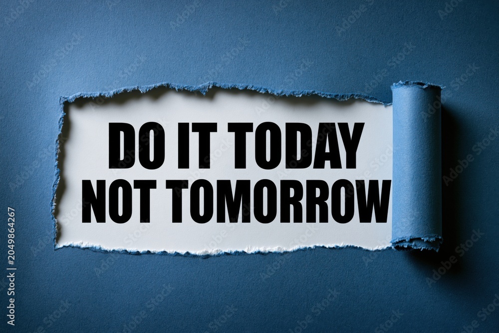 Obraz premium Do it today not tomorrow anti procrastination phrase under torn blue paper