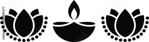 Schilderij op canvas Three lit diya oil lamps for festival or prayer