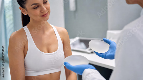 Woman Consulting Surgeon About Breast Implants for Augmentation