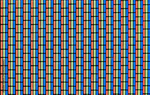 Analog TV Screen Close Up Texture. RGB dots seamless pattern, revealing digital display structure through vibrant red, green, blue color fragments