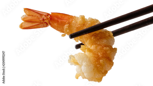 Photography Crispy golden tempura shrimp held by dark chopsticks, isolated on transparent ba