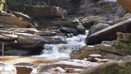 A mountain river that flows through rocky banks in the mountains.
