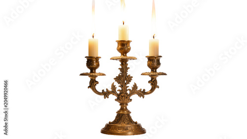 Фотография Ornate golden candelabra with three lit candles, isolated on transparent backgro