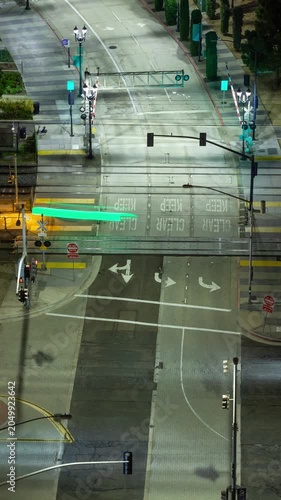Time lapse of a busy intersection in downtown San Diego at night. Vertical video.