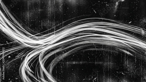Smooth flowing white fiber optic strands creating elegant movement.