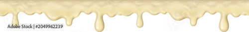 Creamy white chocolate sauce dripping creating a smooth, sweet dessert texture