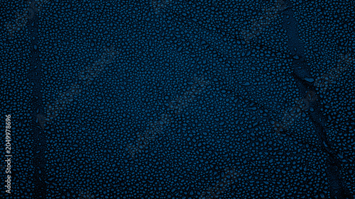 Tableau sur toile Tiny water droplets on dark blue waterproof fabric background