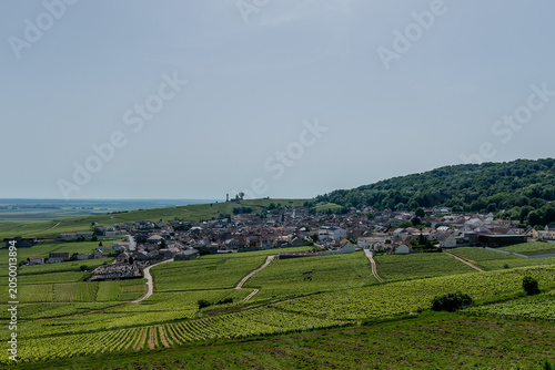 Verzenay,  France, May 24, 2026. A panoramic shot capturing the historic village of Verzenay nestled among lush green Champagne vineyards in France.