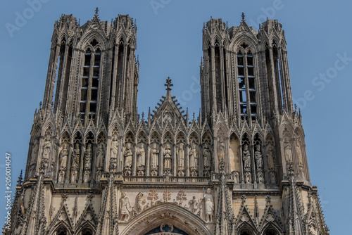 Reims, France, May 24, 2026. A detailed low angle shot of the ornate western facade of the Notre Dame de Reims Cathedral in France, showcasing its intricate Gothic architecture