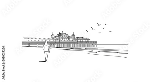 Man standing on the beach shore.