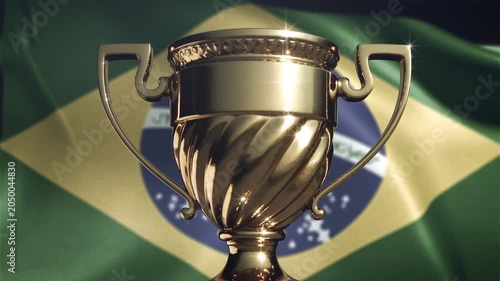 Golden trophy cup gleaming in front of a waving brazilian flag. 4K Video