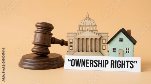 Ownership rights legal concept with wooden judge gavel, courthouse model and house miniature, property law and real estate justice
