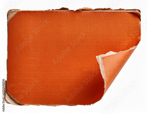 rip corner from old vintage book orange paper scrap isolated for design