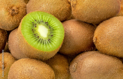 Close-up of many juicy kiwi fruits. Kiwi Fruit - background.