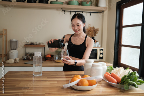 Woman preparing protein shake for health and nutrition