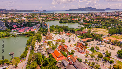 A drone aerial view of Wat Chalong is the most important temple of Phuket, Thailand.  and 1 of 5 must come in the afternoon