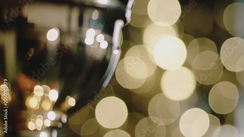 Close up of a golden trophy cup with shimmering bokeh background. 4K Video