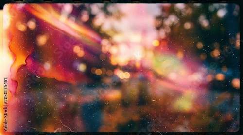 Vibrant abstract bokeh lights through a dirty window at sunset