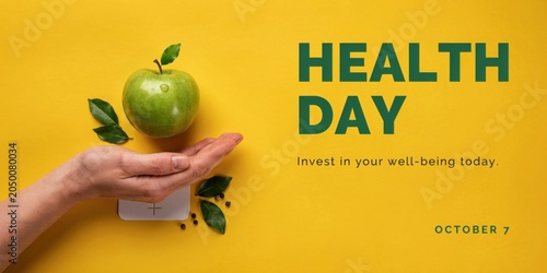 Person holding a green apple on Health Day in a promotional setting