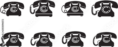 Collection of old rotary phones in various positions and angles  communication devices