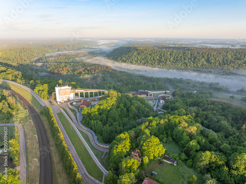 фотографія Sigulda Bobsleigh Track and Misty Gauja Valley at Sunrise, Latvia – Aerial Panor