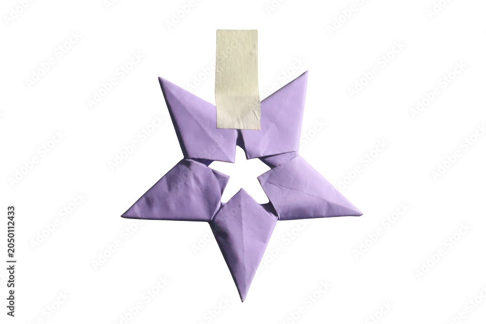 Obraz premium Purple origami star adorned with tape for festive decoration on a transparent background.