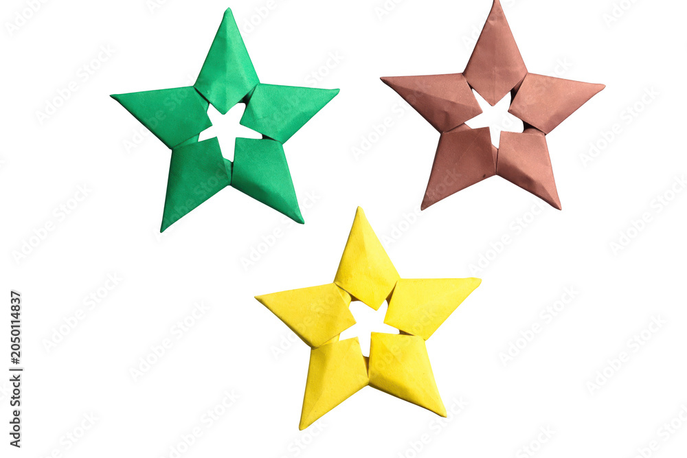 Obraz premium Green red and yellow origami stars arranged in group isolated on transparent background festive decorations.
