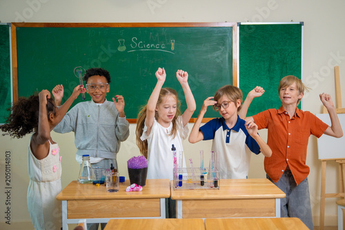 Diversity children doing a chemical experiment in laboratory at school. Kids at elementary school learning science chemistry. Fun study back to school. Education and research. 