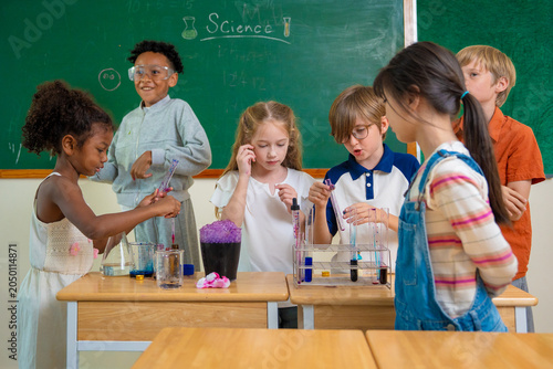 Diversity children doing a chemical experiment in laboratory at school. Kids at elementary school learning science chemistry. Fun study back to school. Education and research. 
