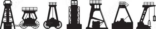 Fotografie Coal mining towers and equipment silhouettes industrial landscape structures for mining industry and historical factory scenes