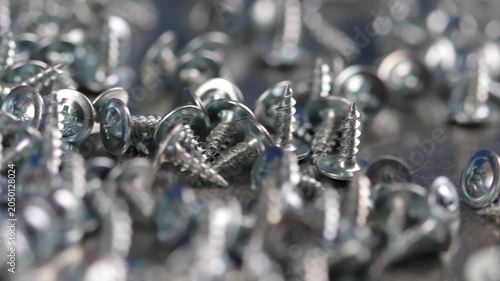 Metal screws for fastening equipment. Soft focus. Close-up. 