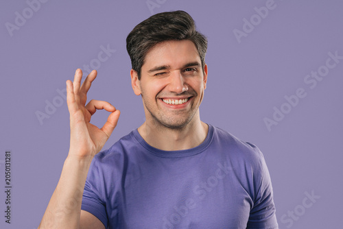 Foto Positive young Man With Ok, Okay Hand Sign Gesture