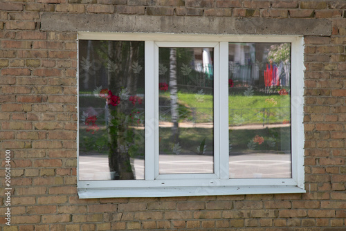 Plastic windows for the building. Replacement of window frames.